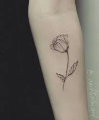 Blue tulip tattoo located on the bicep