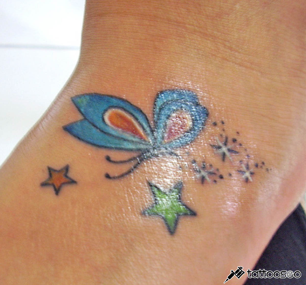 Blue butterfly tattoo
